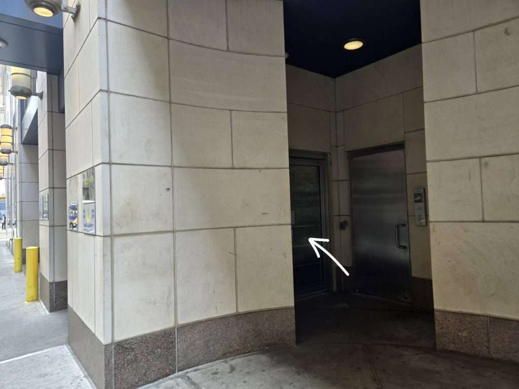 Entrance route marked in the original Manhattan office photograph